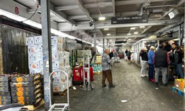 Buyers and sellers haggle over prices of produce and more at Hunts Point.