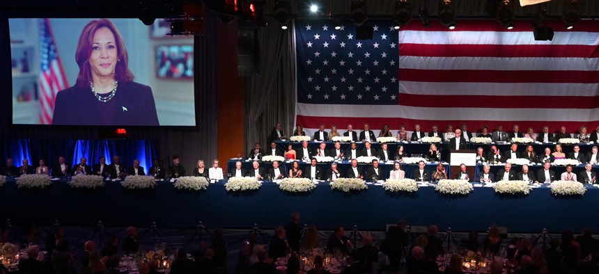 A video message from Vice President Kamala Harris plays during the annual Alfred E. Smith Foundation Memorial Dinner in Manhattan on Oct. 17, 2024.