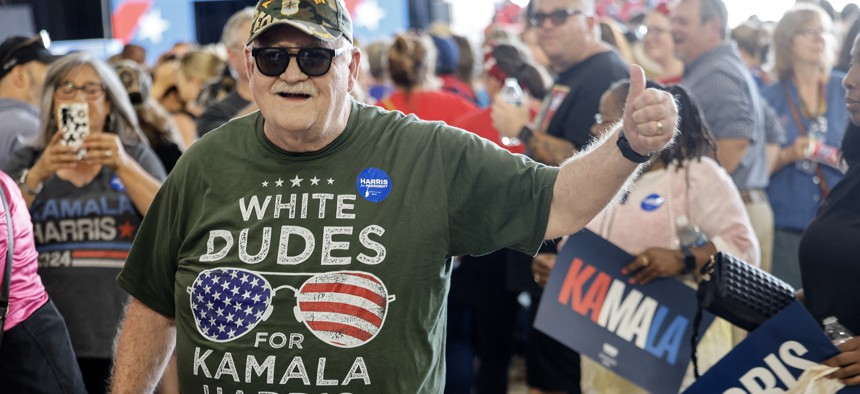 A supporter wears a “White Dudes for Kamala Harris” at a Harris campaign rally in Michigan on Aug. 7, 2024.