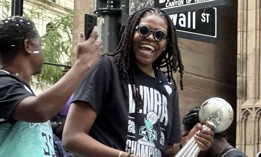 WNBA Finals MVP Jonquel Jones of the New York Liberty celebrates the team’s championship victory from atop a parade float along the Canyon of Heroes in Lower Manhattan on Thursday. 