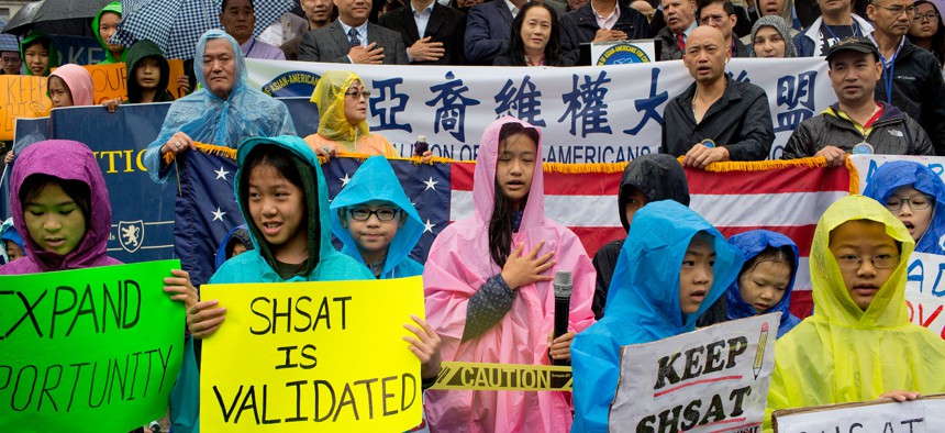 Chinese-American parents and students demonstrate against New York City’s plans to eliminate the Specialized High School Admissions Test on Sept. 9, 2018.