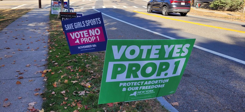 Lawn signs supporting and opposing Prop 1 are seen on a street in Cold Spring.