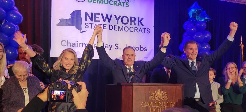 Laura Gillen, Jay Jacobs and Rep. Tom Suozzi  address Democratic supporters at the Garden City Hotel on election night.