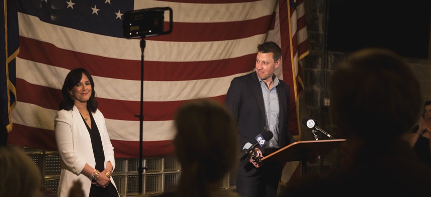 Rep.-elect Josh Riley speaks to reporters following his election victory on Nov. 5, 2024, as his wife Monica looks on.