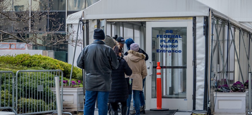 People lined up to enter 26 Federal Plaza in lower Manhattan, home to immigration court where asylum and deportation hearings are held.