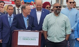 State Democratic Party Chair Jay Jacobs, center, and state Sen. Kevin Thomas, right, attend a protest outside of a Trump rally on Long Island in September 2024.