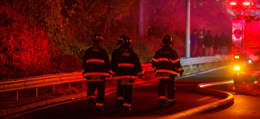 New York City firefighters battling a brushfire in Washington Heights amid a citywide drought warning on November 19.