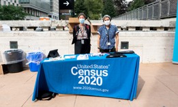 U.S. Census workers stand outside Lincoln Center on Sept. 24, 2020.