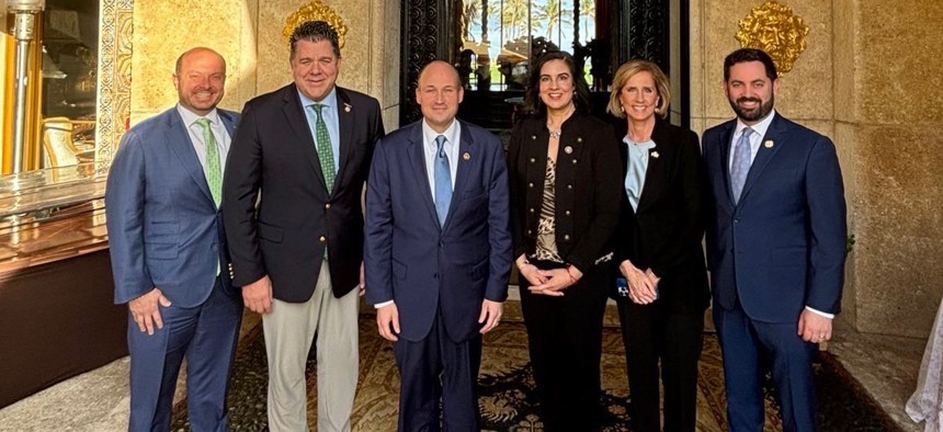 Reps. Andrew Garbarino, Nick Lalota, Nick Langworthy, Nicole Malliotakis, Claudia Tenney, and Mike Lawler pose outside Mar-a-Lago where they asked Trump for a special New York favor.