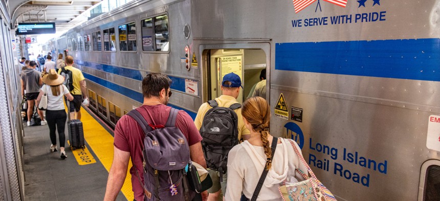 Commuters board a Long Island Rail Road train on Aug. 22, 2024.