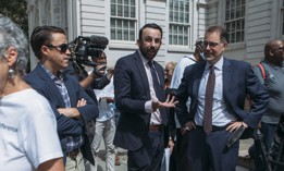 Council Member Keith Powers, center, speaks with Manhattan Borough President Mark Levine, right, outside City Hall in 2022. 