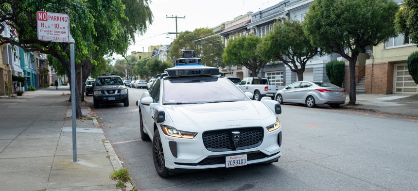 A Waymo self-driving car is seen on the street in San Francisco.