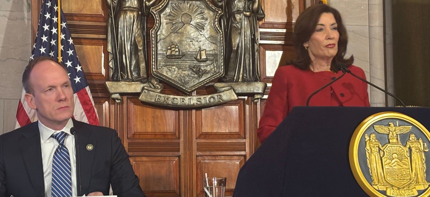 Gov. Kathy Hochul, right, and state Budget Director Blake Washington, left, discuss the Fiscal Year 2026 executive budget proposal.