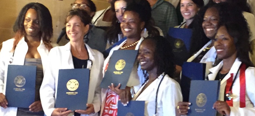 Medical students graduate from the Latin American School of Medicine in Cuba.