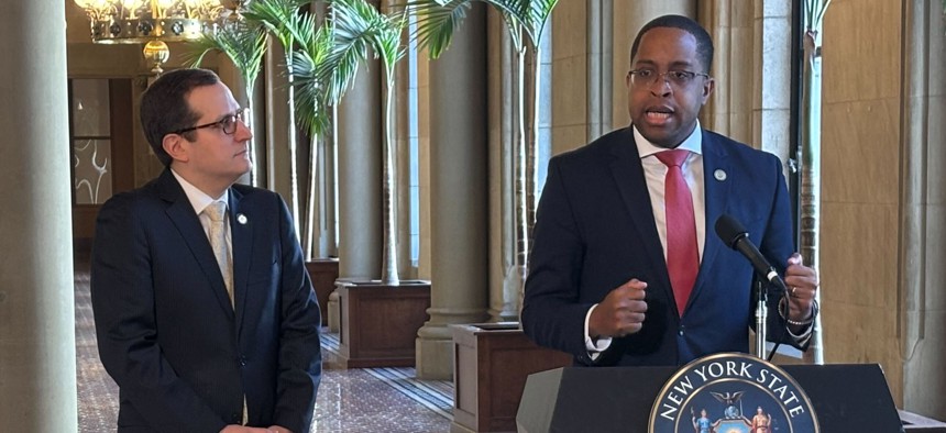 Assembly Member Micah Lasher looks on as state Sen. Zellnor Myrie discusses their proposed discovery reform bill.