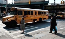 A yeshiva bus drives through the Borough Park neighborhood of Brooklyn on Sept. 12, 2022.