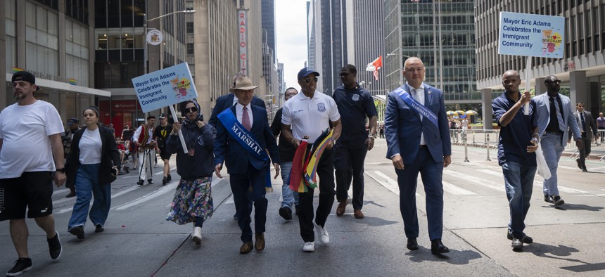 New York City Mayor Eric Adams walks in the Immigrant Day Parade in June 2023.