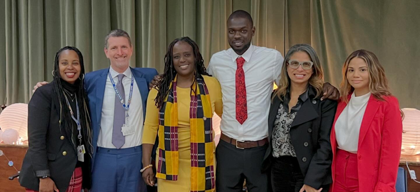 State Sen. Cordell Cleare (third from left) and Manhattan Deputy Borough President Keisha Sutton-James (second from right) pose with leaders of the SkillSpring program, which trains young adults from underserved communities to become certified nursing assistants.