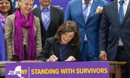 Gov. Kathy Hochul signs into law a package of bills to strengthen protections for survivors of domestic and gender-based violence on Oct. 18, 2022.