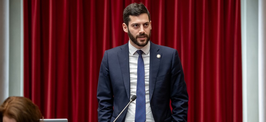 Assembly Member Alex Bores stands in the Assembly chamber on March 12, 2025.