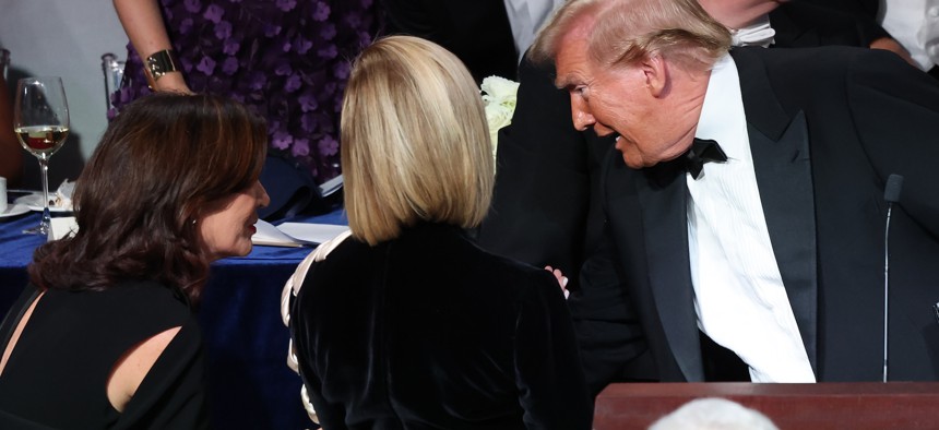 Gov. Kathy Hochul, left, and President Donald Trump, right, speak at the Alfred E. Smith Foundation Dinner on Oct. 17, 2024 – one of their few public appearances together.