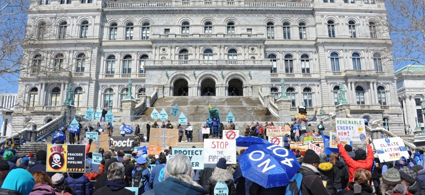 Protesters rally in front of the state Capitol against the planned Constitution pipeline in 2016.