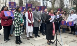 Speaker Adrienne Adams addresses the crowd at a March 29 Working Families Party rally while Zohran Mamdani (in the red scarf) looks on. 