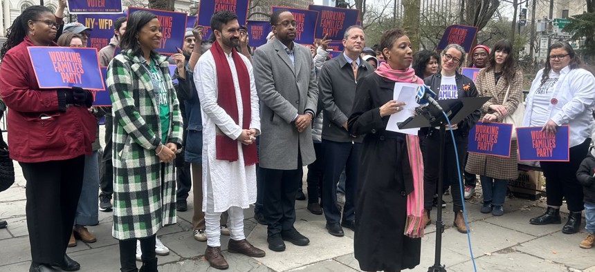 Speaker Adrienne Adams addresses the crowd at a March 29 Working Families Party rally while Zohran Mamdani (in the red scarf) looks on.