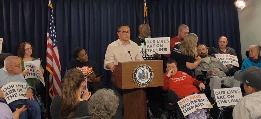State Sen. Ron Kim speaks at a rally with advocates critical of the Consumer Directed Personal Assistance Program transition.