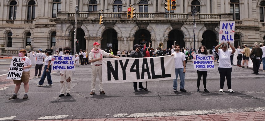 Advocates protest in favor of the New York for All Act outside the state Capitol on June 12, 2025.