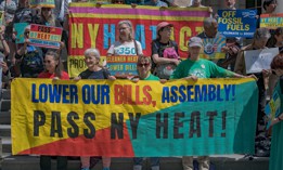 Demonstrators at an Earth Day rally call on the Assembly to pass the NY HEAT Act.
