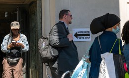 People wait in line to vote in the Bronx in 2024.