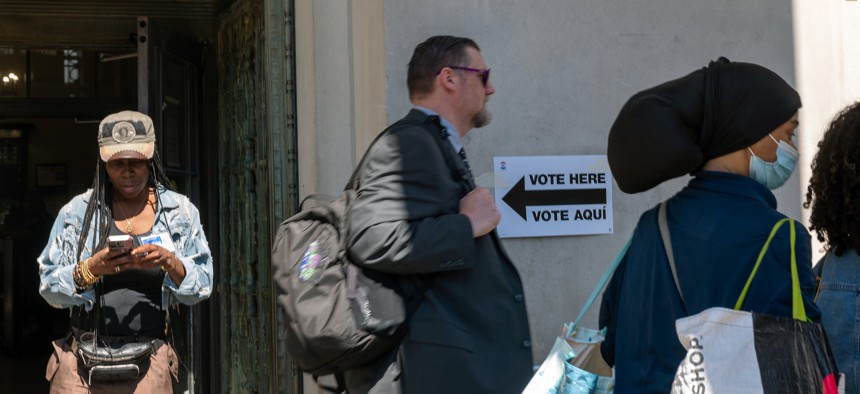 People wait in line to vote in the Bronx in 2024.