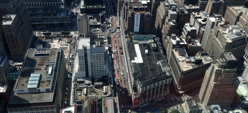 Traffic moves slowly past Macy’s along 34th Street in Manhattan.