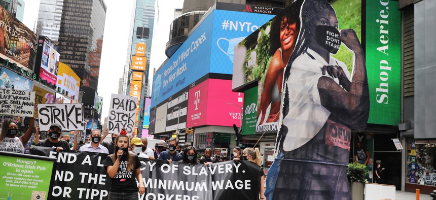 Activists rally in Times Square for an end to the subminimum wage for tipped workers on Aug. 31, 2020.