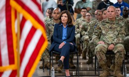 Gov. Kathy Hochul sits next to National Guard Major General Raymond Shields as she announces a deployment of additional National Guard troops to assist asylum-seekers on Sept. 25, 2023.
