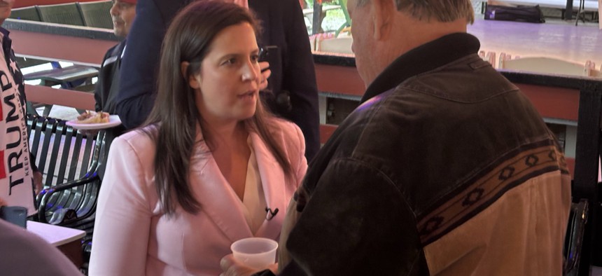 Rep. Elise Stefanik speaks with an attendee at a clambake fundraiser in Vestal on Aug. 26, 2025.