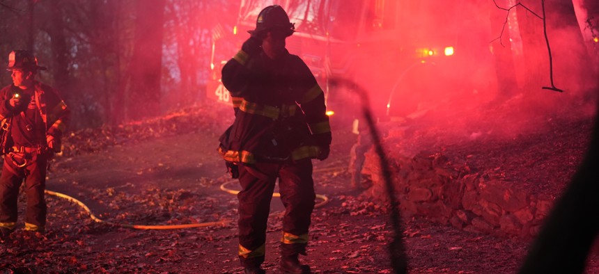 A firefighter at the scene of a brush fire in Inwood Hill Park in November 2024.