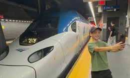 Oliver Lees, 12, of Queens takes a selfie with Amtrak’s second-generation Acela Express, after it pulled into the Moynihan Train Hall at Penn Station for its first official passenger run Thursday. 