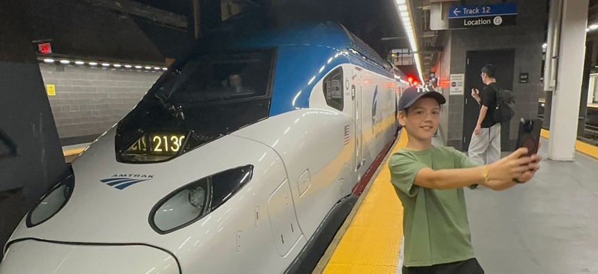Oliver Lees, 12, of Queens takes a selfie with Amtrak’s second-generation Acela Express, after it pulled into the Moynihan Train Hall at Penn Station for its first official passenger run Thursday.