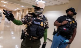 A masked federal agent on duty in 26 Federal Plaza