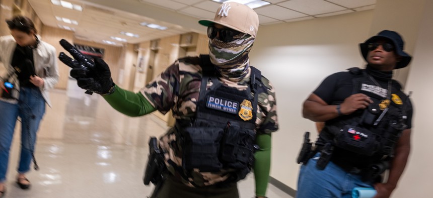 A masked federal agent on duty in 26 Federal Plaza