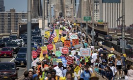 Climate activists march across the Brooklyn Bridge to demand that Gov. Kathy Hochul reject a natural gas pipeline project.