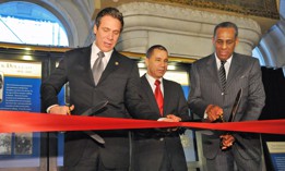 Then Gov. Andrew Cuomo cuts a ribbon on a Black history exhibit with former Gov. David Paterson and then-SUNY Board of Trustees Chair Carl McCall in 2012.