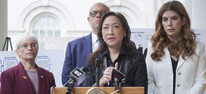 New York City Council Members Linda Lee, center, and Julie Menin, right, call for Congress to fully fund the World Trade Center Health Program at a press conference on Sept. 10, 2025.