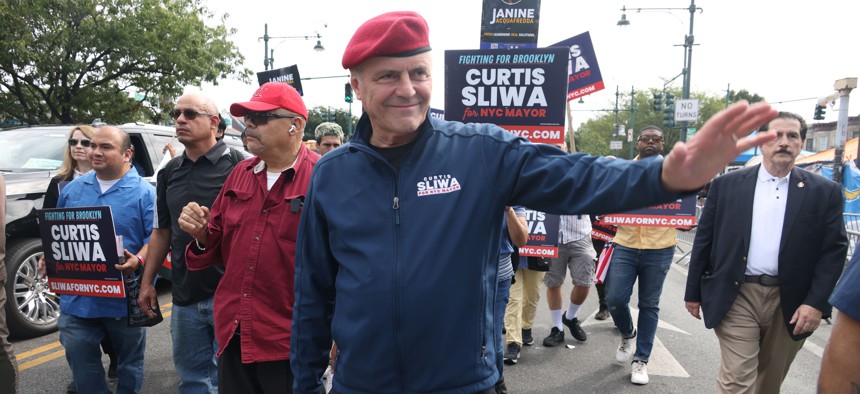 New York City mayoral candidate Curtis Sliwa marches in the West Indian Day parade.