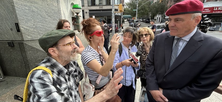 Curtis Sliwa is unafraid to host a press conference in view of vocal New Yorkers. Here he talks to supporter Bill Apple.