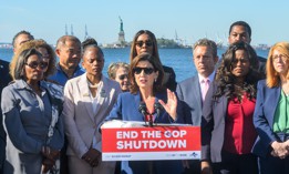 Gov. Kathy Hochul speaks about the impact of the government shutdown in front of the Statue of Liberty, whose workforce has been furloughed due to the shutdown, on Oct. 1, 2025.