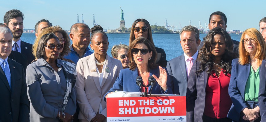 Gov. Kathy Hochul speaks about the impact of the government shutdown in front of the Statue of Liberty, whose workforce has been furloughed due to the shutdown, on Oct. 1, 2025.