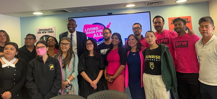 Elected officials and activists celebrate the launch of the “Living Wage for All Coalition” on Sept. 30, 2025.